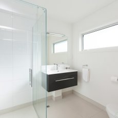 Bathroom looking toward the vanity at The Dawson Motel New Plymouth. Call 06 758 1177